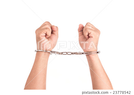 Close up hands with silver handcuffs isolated on white 23778542