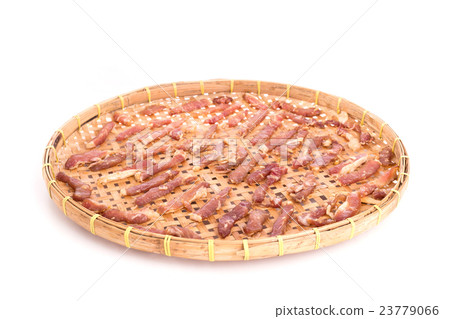 Dried meat on bamboo weave tray isolated on white Dried meat on bamboo weave tray isolated on white 23779066