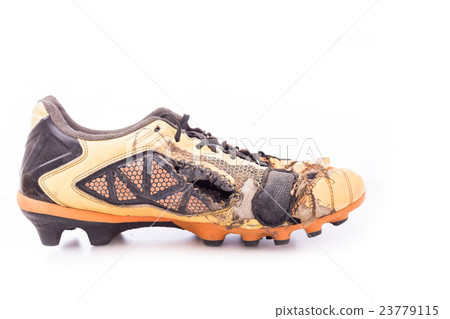 Old football shoes isolated on white Old football shoes isolated on white 23779115