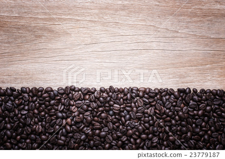 Coffee beans on wooden background, Composition with free space of wood Coffee beans on wooden background, Composition with free space of wood 23779187