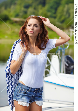 woman wearing sea cloths and sexy sailor T-shirt. woman wearing sea cloths and sexy sailor T-shirt. 23780224