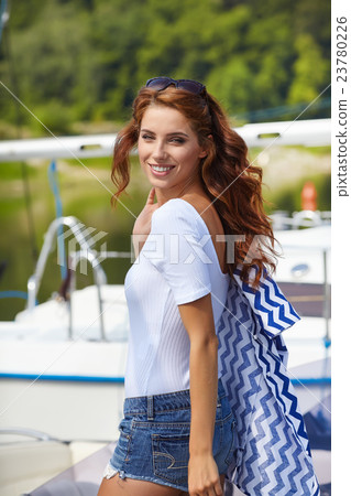 woman wearing sea cloths and sexy sailor T-shirt. woman wearing sea cloths and sexy sailor T-shirt. 23780226