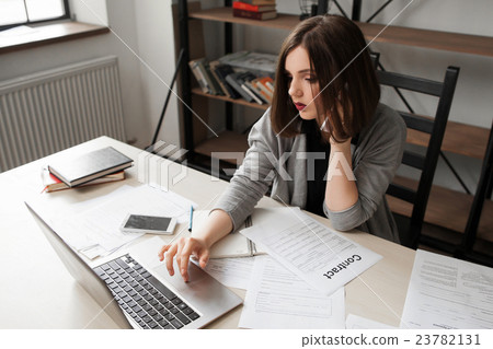 Business woman talking on phone in office 23782131