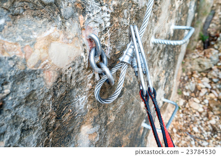 Climbing carabiner on a steel rope Climbing carabiner on a steel rope 23784530