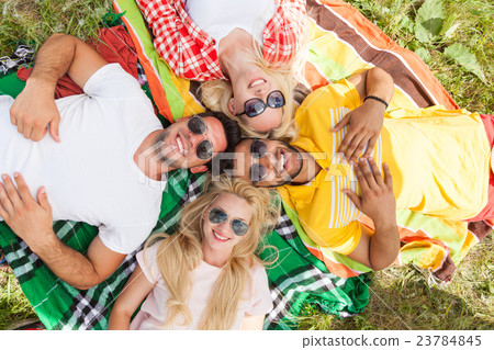 Happy people group young friends lying down on Happy people group young friends lying down on 23784845