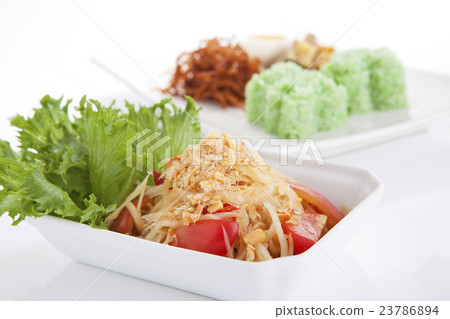 Papaya salad with green sticky rice on background Papaya salad with green sticky rice on background 23786894