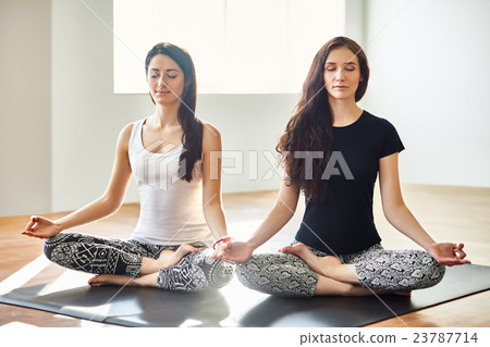 womens doing yoga asana supported headstand 23787714