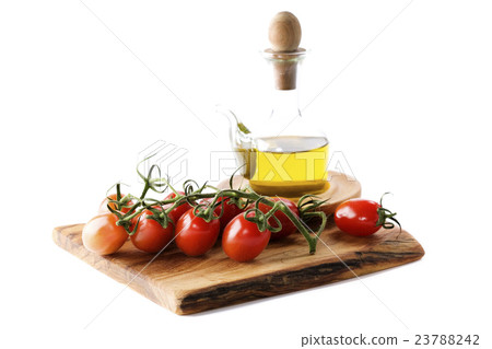 Bottle of olive oil and tomatoes Bottle of olive oil and tomatoes 23788242