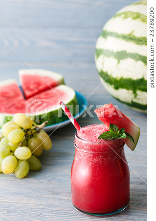 Water melon smoothie on blue wooden background 23789200