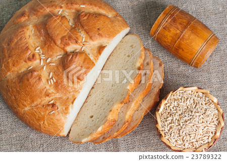 Sliced white bread and seeds of oats 23789322