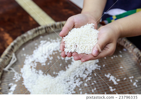 Boy holding rice Boy holding rice 23796335