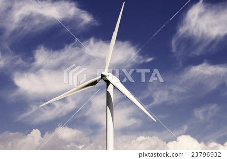 wind turbine against partly cloudy blue sky 23796932