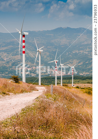 landscape with hills and wind turbines 23796933