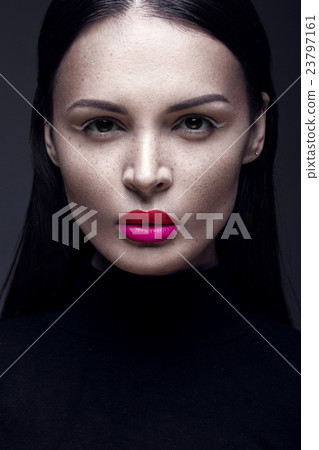 Beautiful brunette girl in a black dress, straight Beautiful brunette girl in a black dress, straight 23797161