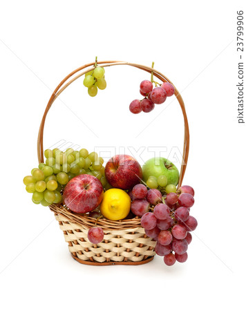 grapes, apples and lemon in a wicker basket 23799906