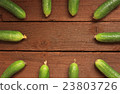 Cucumbers on wooden background 23803726