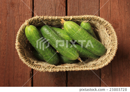 Cucumbers in a basket 23803728