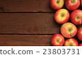 Apples on wooden background 23803731