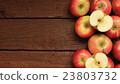 Apples on wooden background 23803732