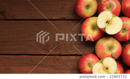 Apples on wooden background 23803732