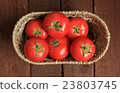 Tomatoes in a basket 23803745