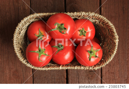 Tomatoes in a basket 23803745