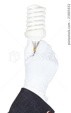 male hand in suit and glove holds CFL lamp 23805832