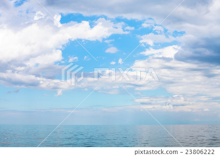 scenery of blue sky with white clouds over calm sea scenery of blue sky with white clouds over calm sea 23806222