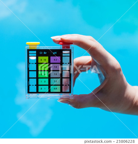 testing chlorine pollution in blue water of pool 23806228