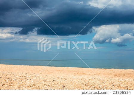 landscape with sand beach and rain clouds over sea landscape with sand beach and rain clouds over sea 23806524