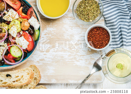 Greek salad with olive oil, bread, herbs and white 23808118
