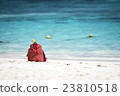 red bag on the beach 23810518