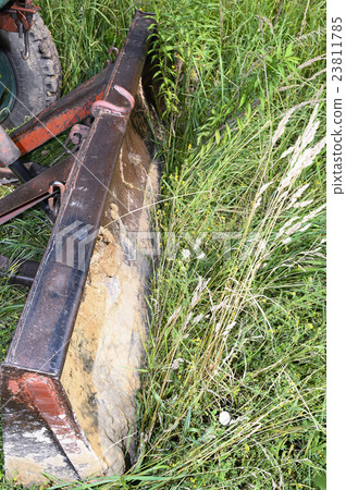 Bulldozer, destroying the plants growing on soil 23811785