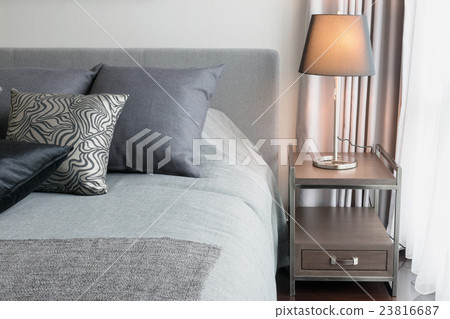 stylish bedroom with black pattern pillows on bed 23816687