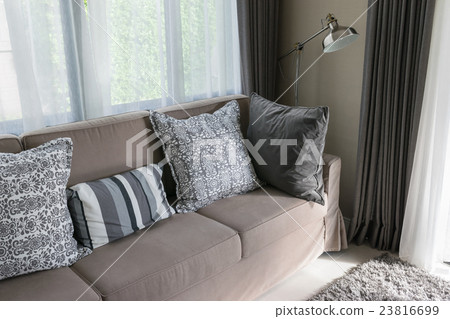 Sturdy brown tweed sofa with grey pattern pillows 23816699