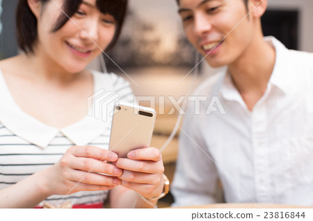 A couple listening to music 23816844