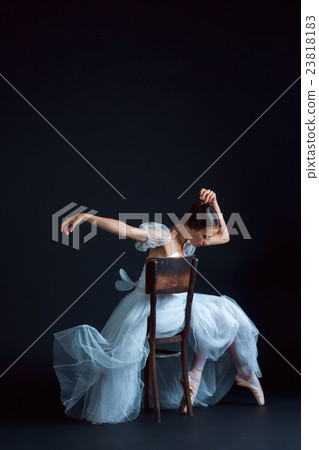 Portrait of the classical ballerina in white dress 23818183