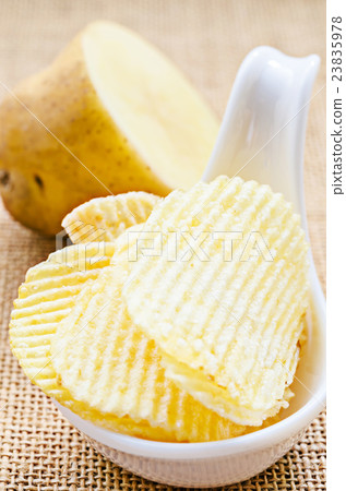 chips and peeled potato. chips and peeled potato. 23835978