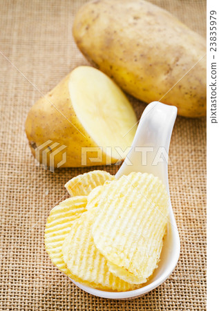 chips and peeled potatos chips and peeled potatos 23835979