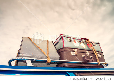 Vintage bags on the car's roof 23841094