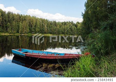 Old wooden boat on the river in Karelia Old wooden boat on the river in Karelia 23843491