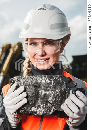 Worker with coal in the hands 23844910