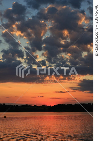 Summer clouds at sunset over Lake Pfaeffikersee Summer clouds at sunset over Lake Pfaeffikersee 23845046