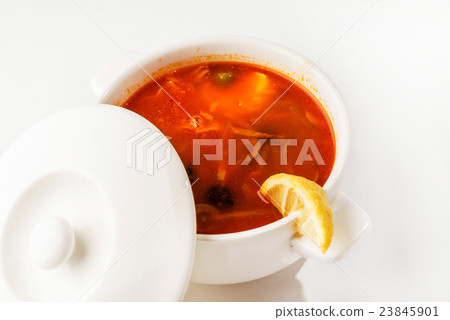 Solyanka mix soup with sausages, olives and lemon 23845901