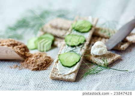 Stack of crispbreads with cream cheese 23847428