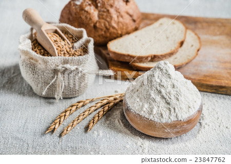 Wheat and flour on the table 23847762