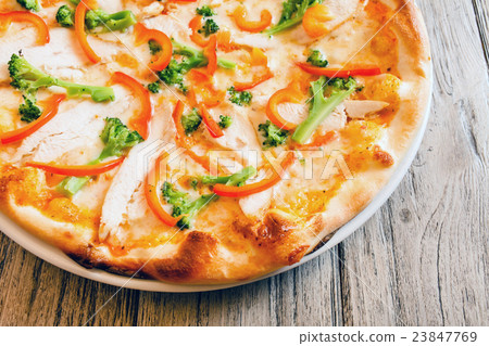 pizza on wooden background pizza on wooden background 23847769