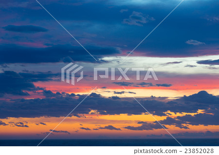 Colourful sunset with clouds and sunbeams Colourful sunset with clouds and sunbeams 23852028