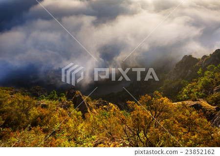Misty dawn over mountains and river 23852162
