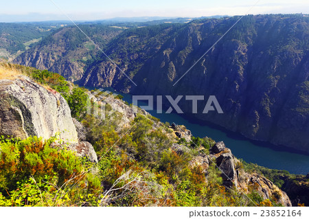 river with steep rocky banks river with steep rocky banks 23852164